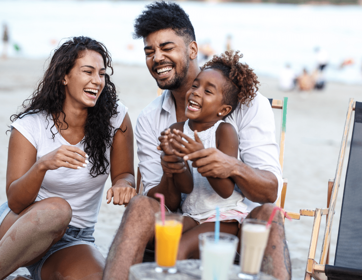 Family of three laughing