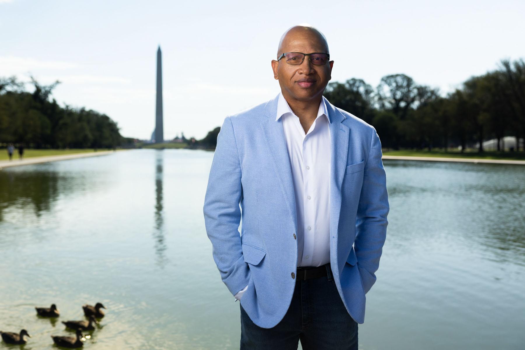 Image of Sacoby Wilson standing on National Mall in front of Washington Monument