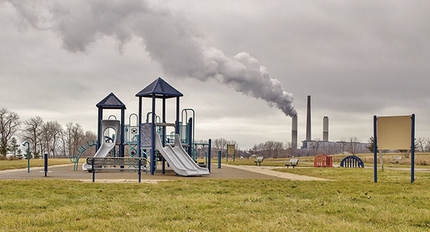 Playground near power plant in a cloudy day