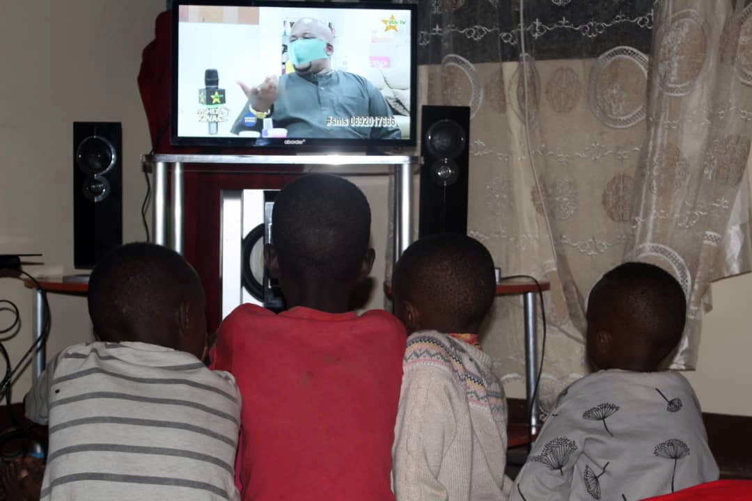 African kids watching TV