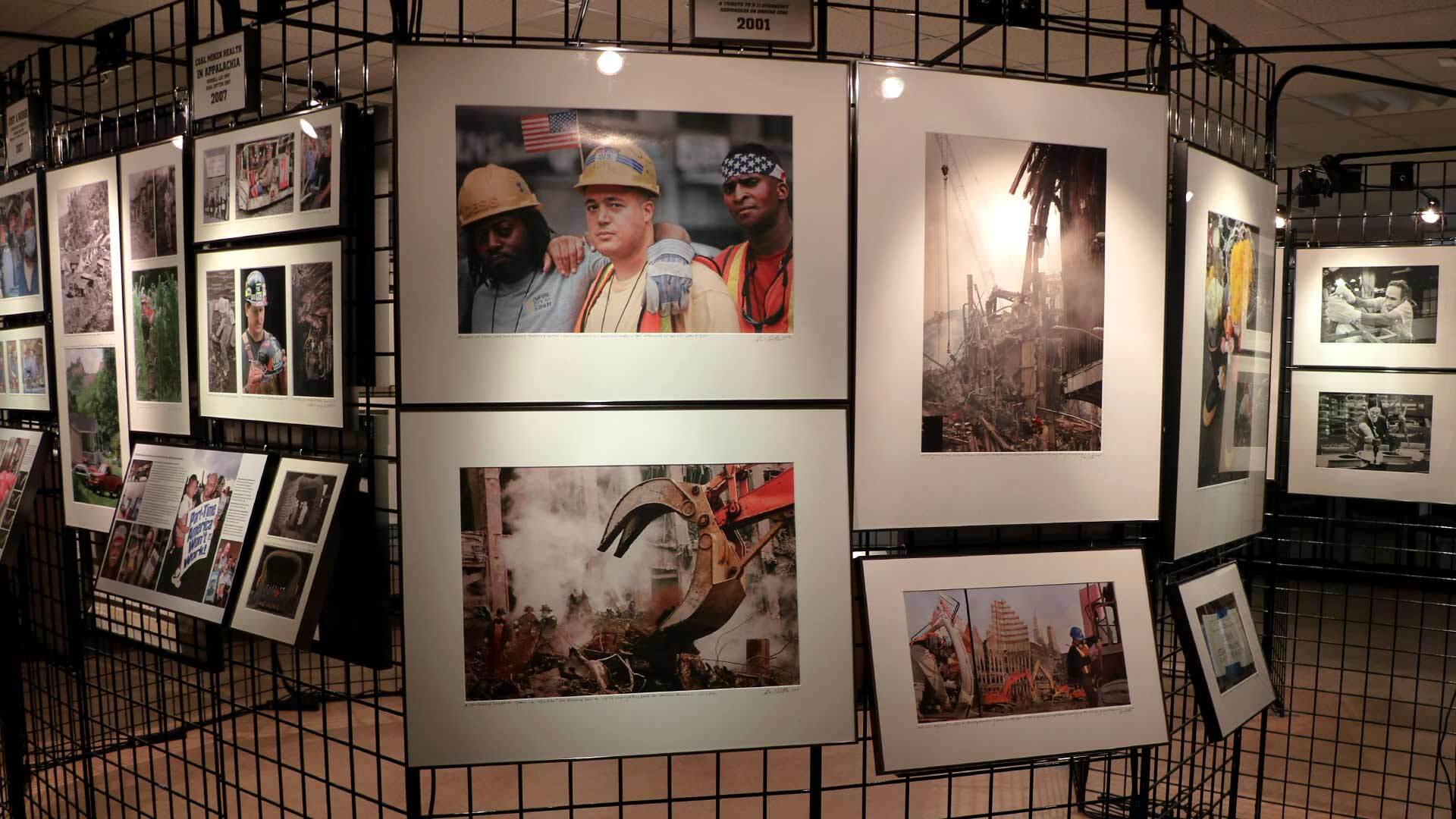 Earl Dotter's photography exhibit. Centers four framed photos of labor in the wake of 9/11.