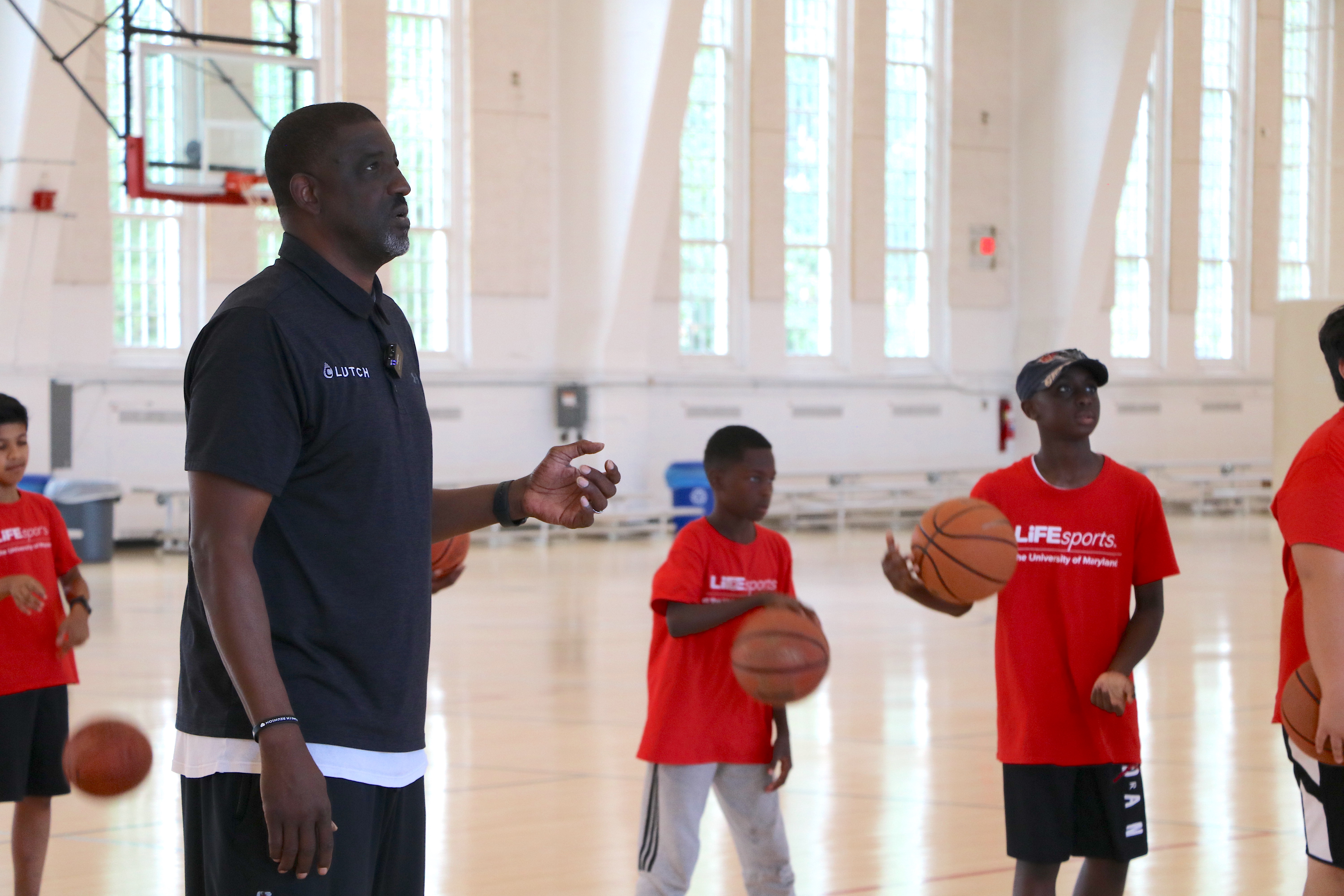 Former NBA player coaching summer camp for kids