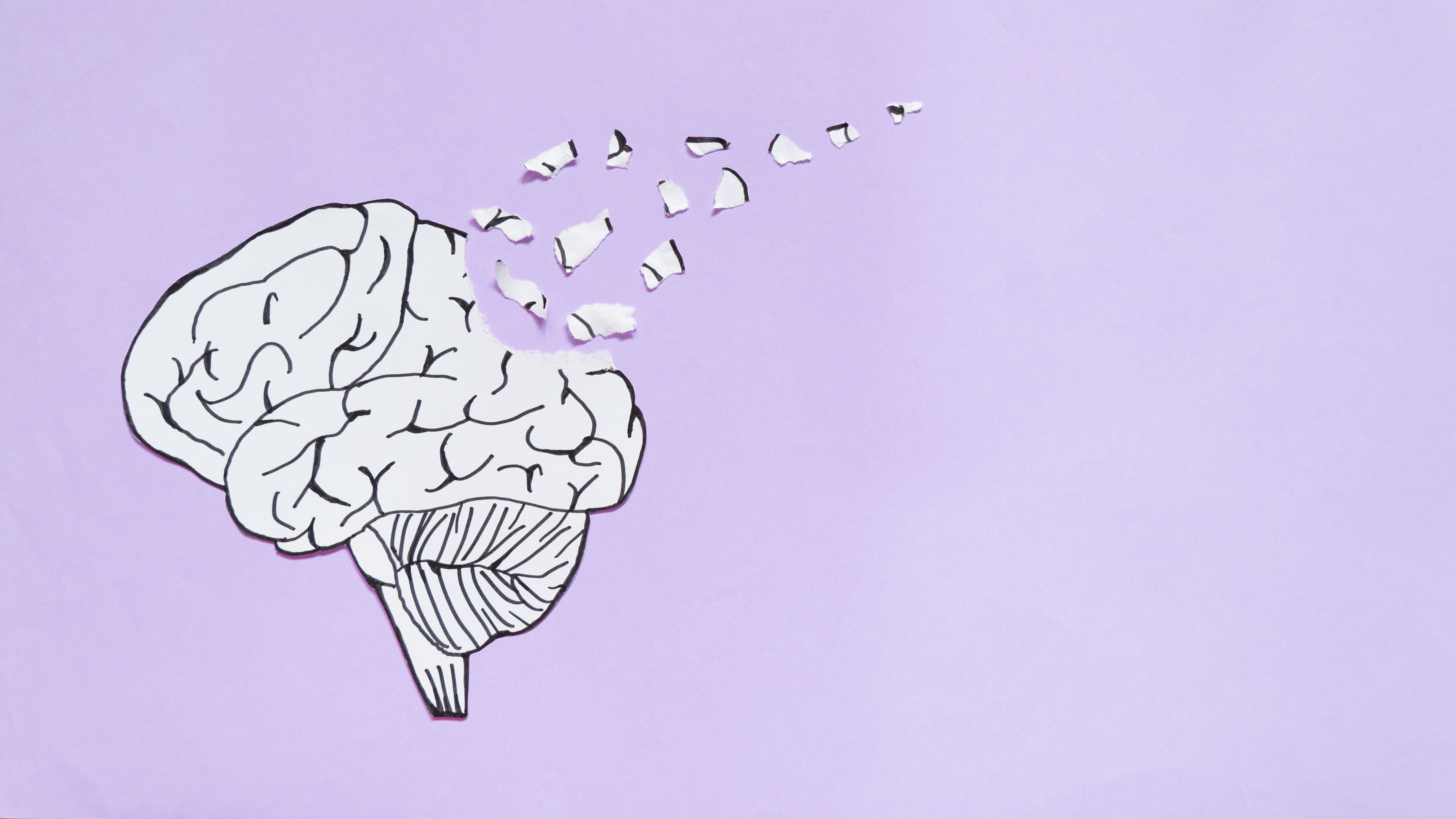 illustration of a brain in B&W with some parts dislodging and flying away