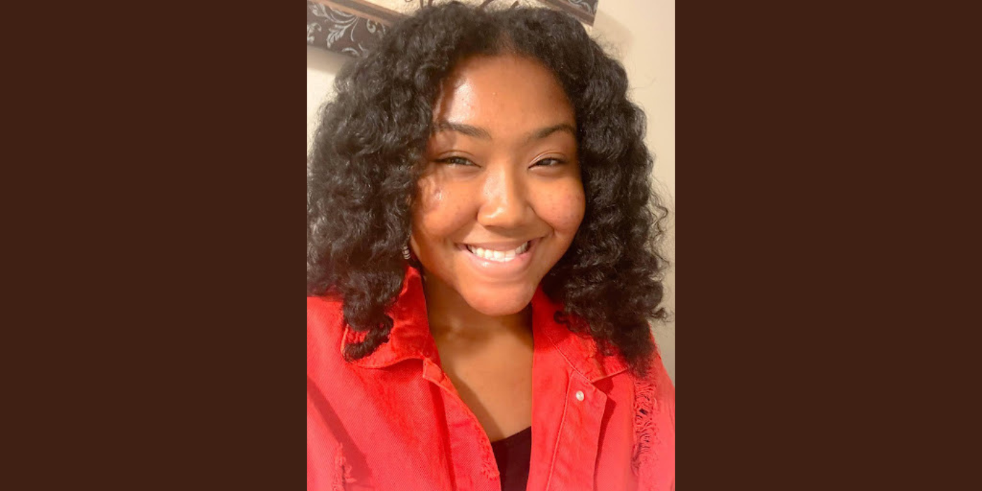 Black female student wearing a red shirt