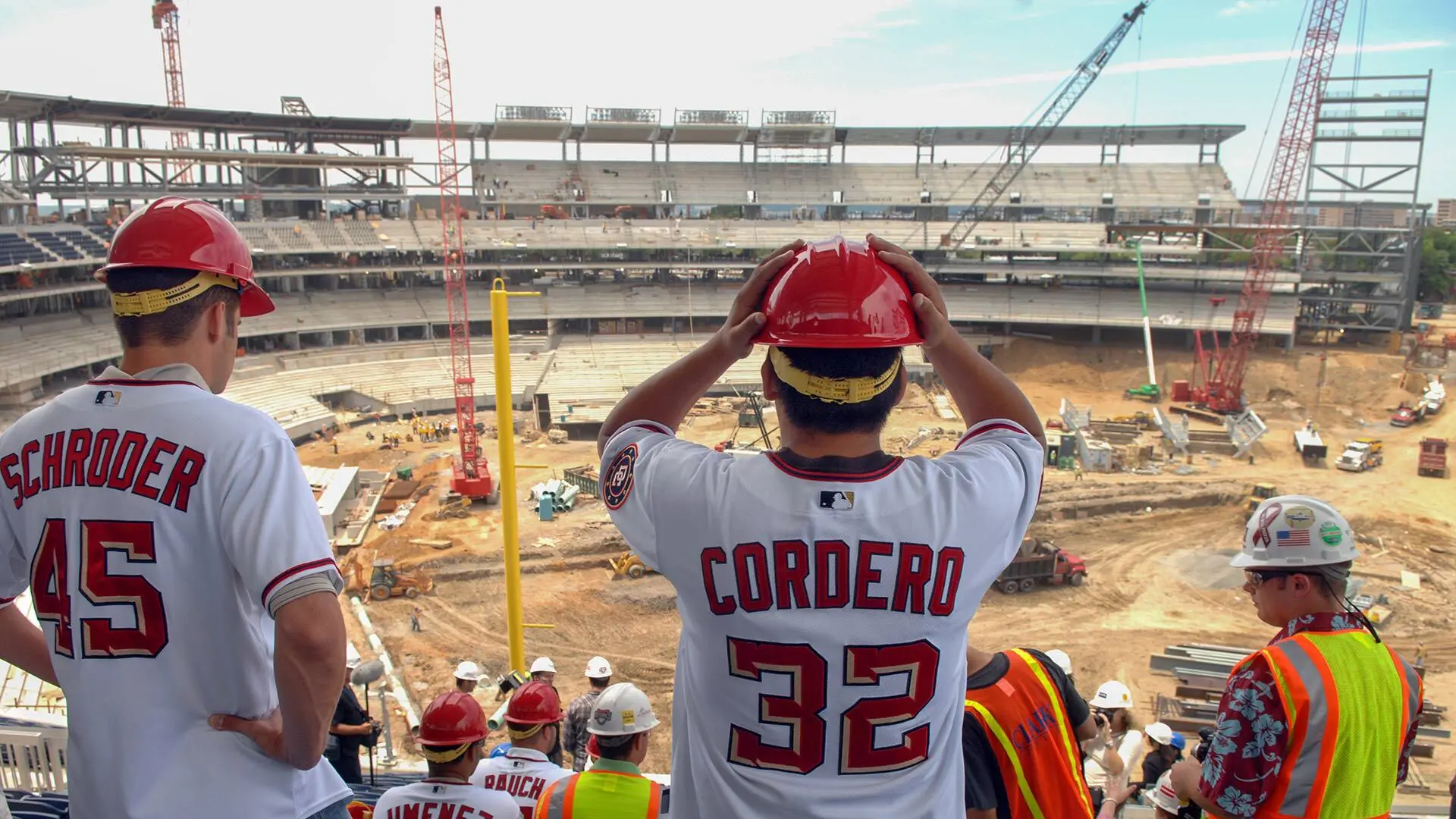 Pitchers Cordero and Schroder and construction worker overlooking construction in new Nats stadium from 2007