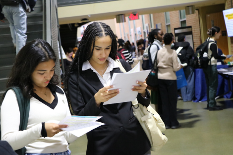 two students looking at their resumes