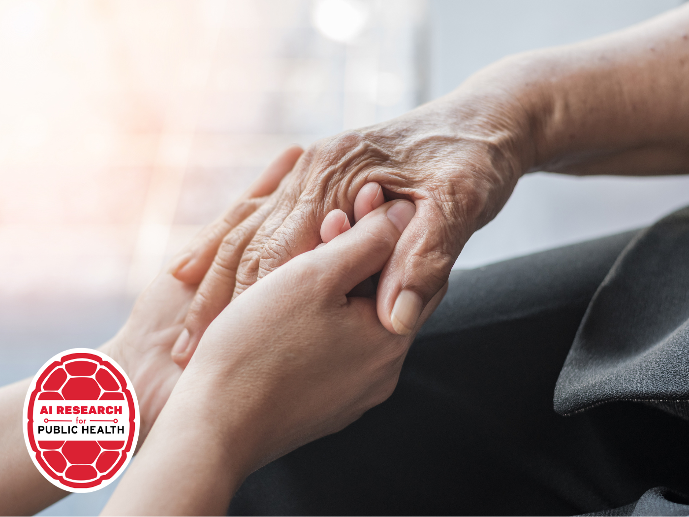 young hands hold an elder's hands