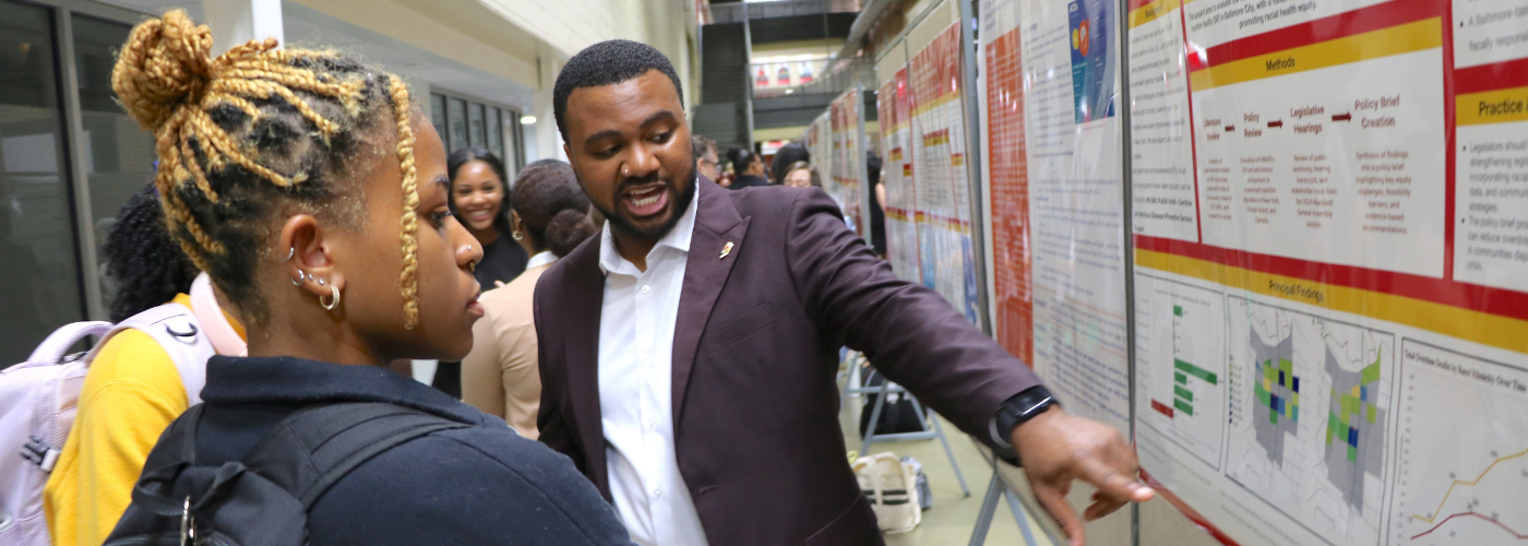 Black male student giving a presentation