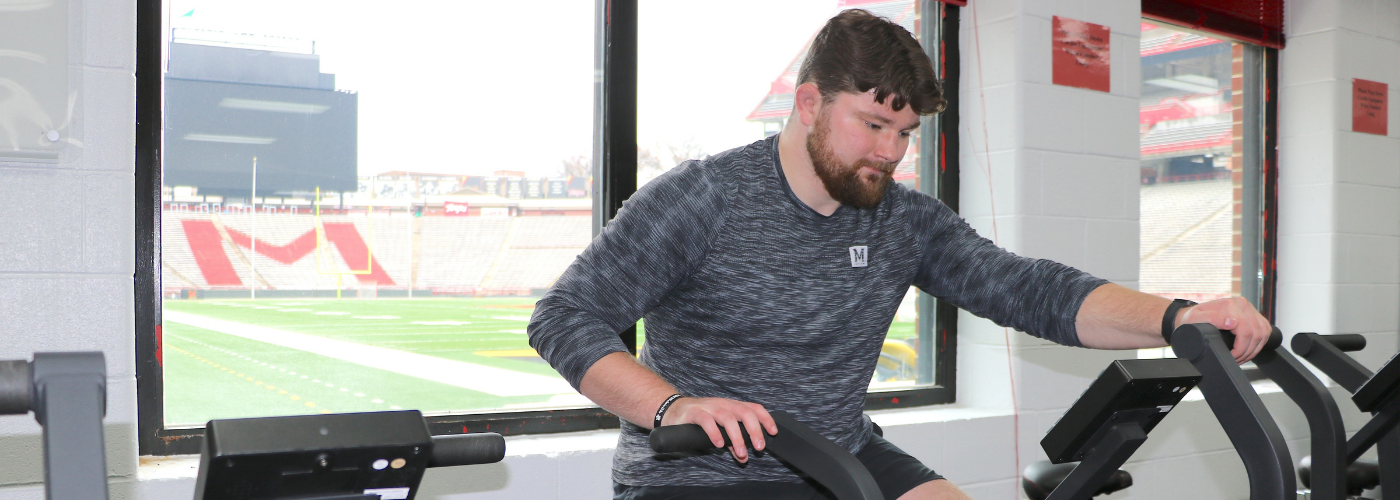 male student on workout equipment