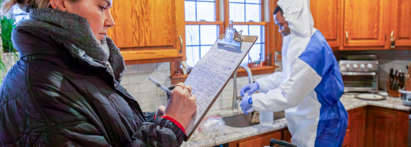 two students testing water inside a home
