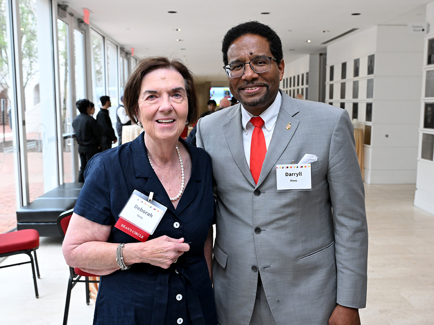 Alumna Deb Rudy ’73 standing with President Darryll Pines