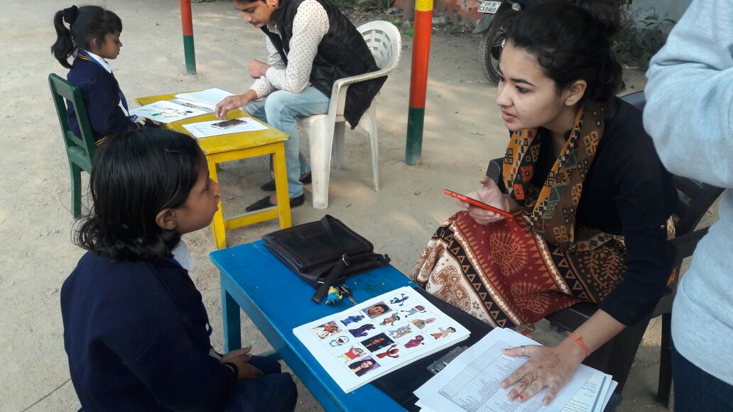 child learning from teacher at school in Lucknow, India