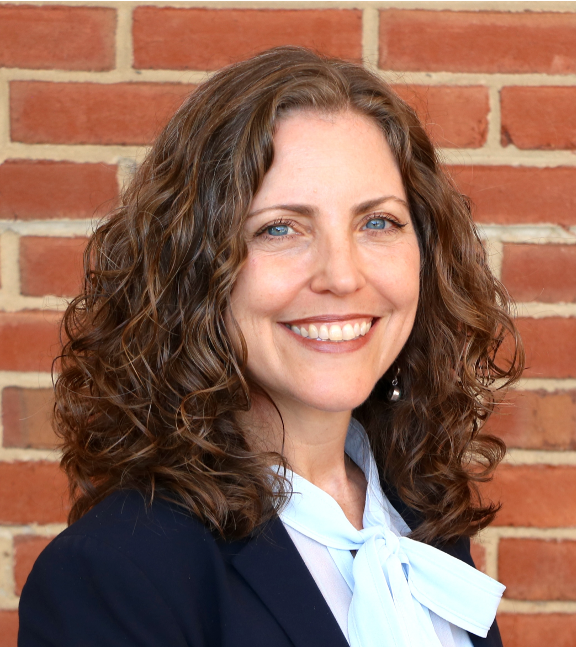 Woman in professional attire.