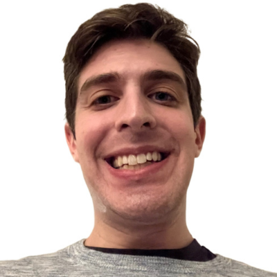 male with brown hair, smiling 