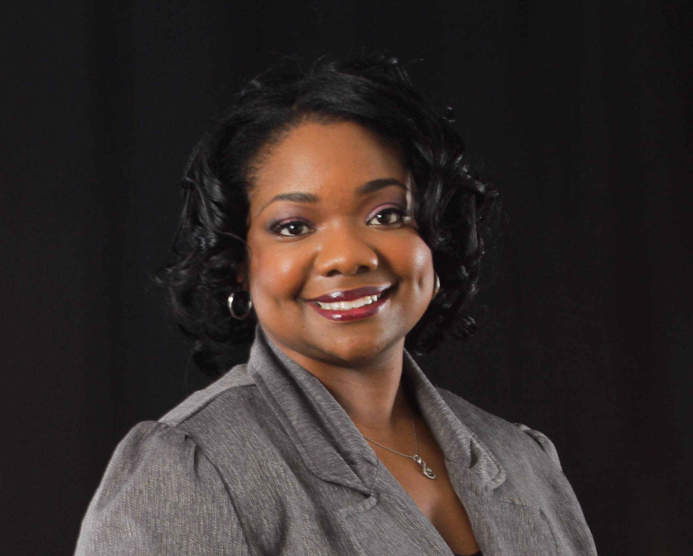 Black woman in grey business attire