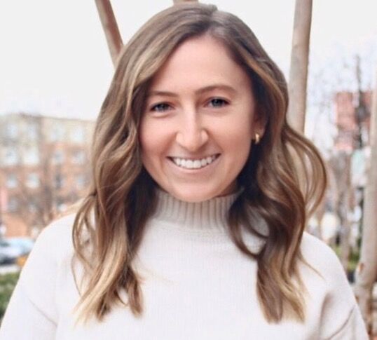 Portrait photo of Sarah Salinger smiling outdoors.