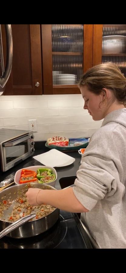 Ella Gauthier prepares a meal