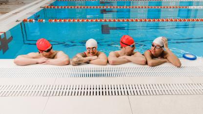 Students resting in the pool after class