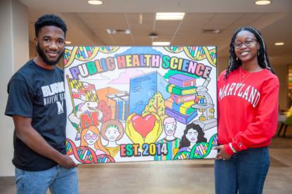 students holding public health science sign