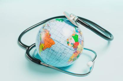 Small globe toy with medical equipment on it