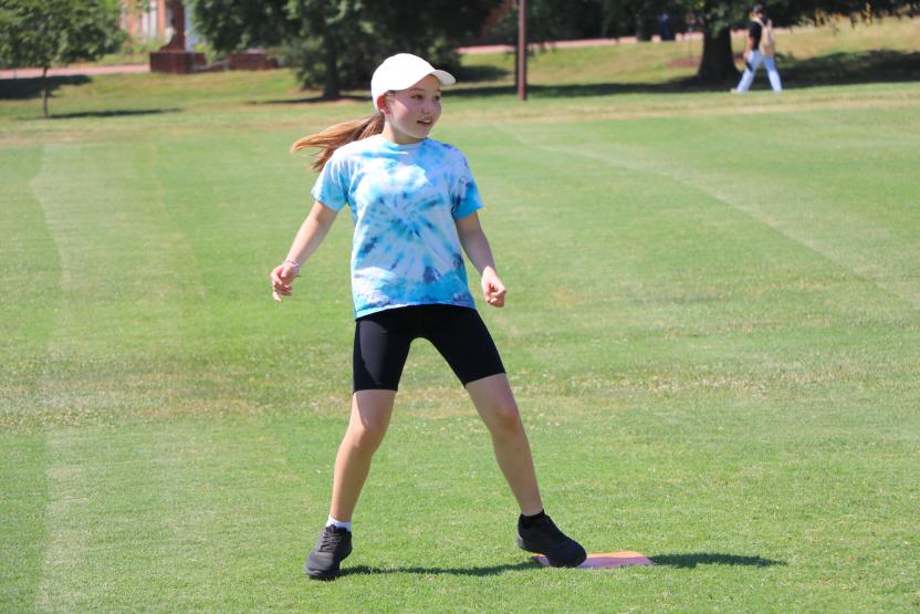 Kid standing on second base during kickball