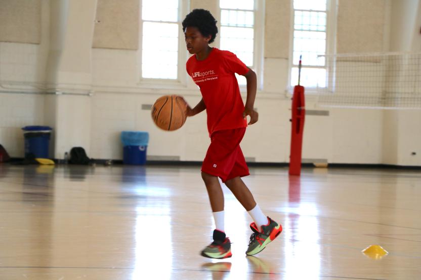 Kid playing basketball