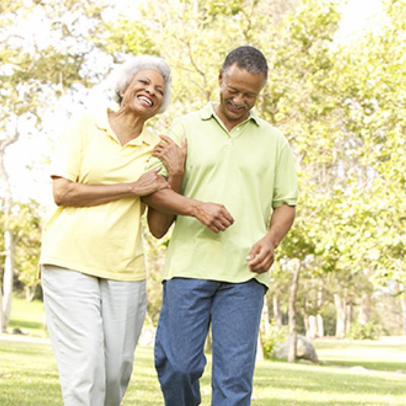 Happy older couple walking and laughing
