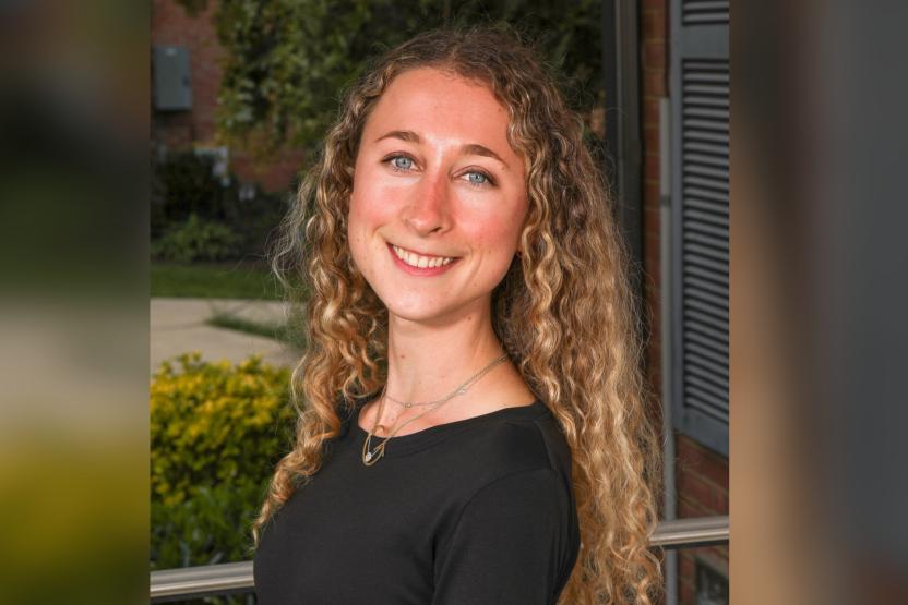 Female student smiling wearing a black top