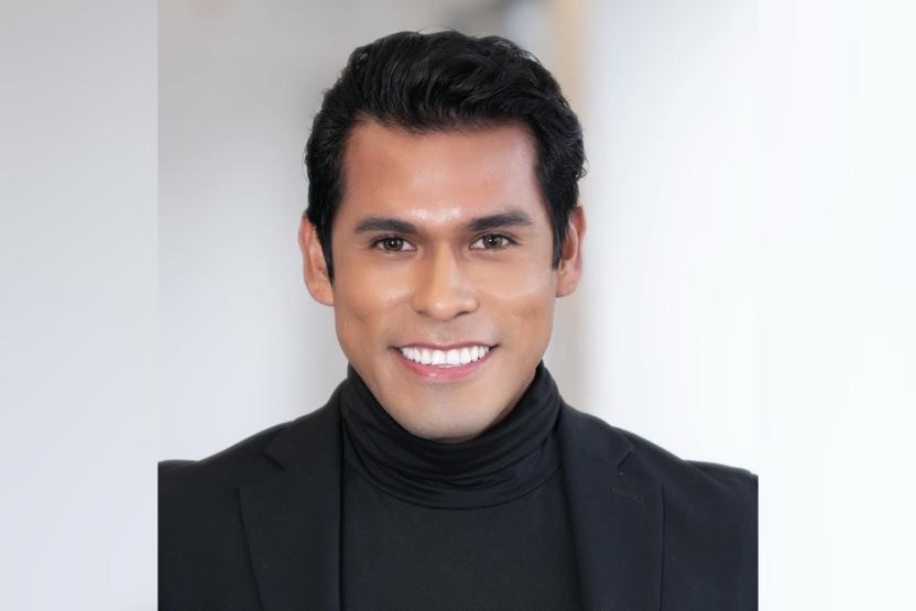 man in black turtle neck and blazer