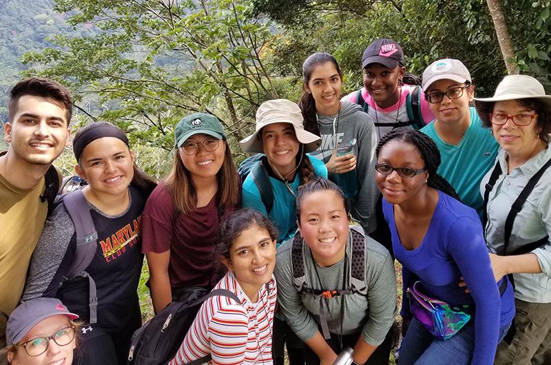 Group of students smiling for a photo in Bolivia for a study abroad trip hike.