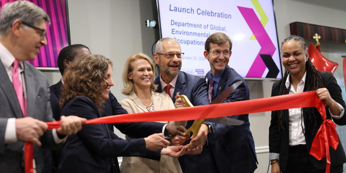 Group of UMD leaders and graduates cut ribbon to celebrate new department