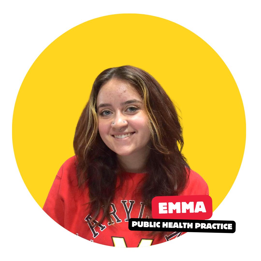 student smiling at camera with solid color background