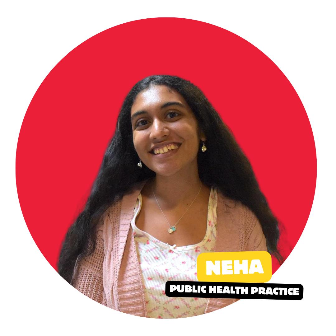 student smiling at camera with solid color background