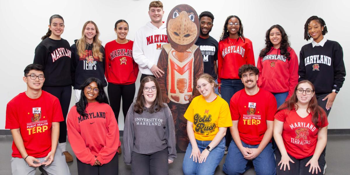 group of students posing with Testudo cutout