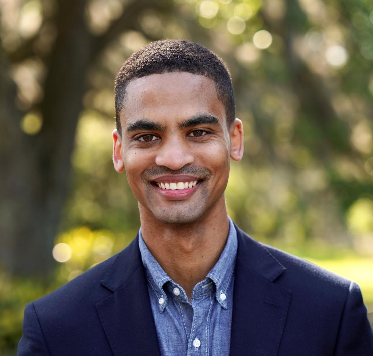 Student awardee smiles to camera 