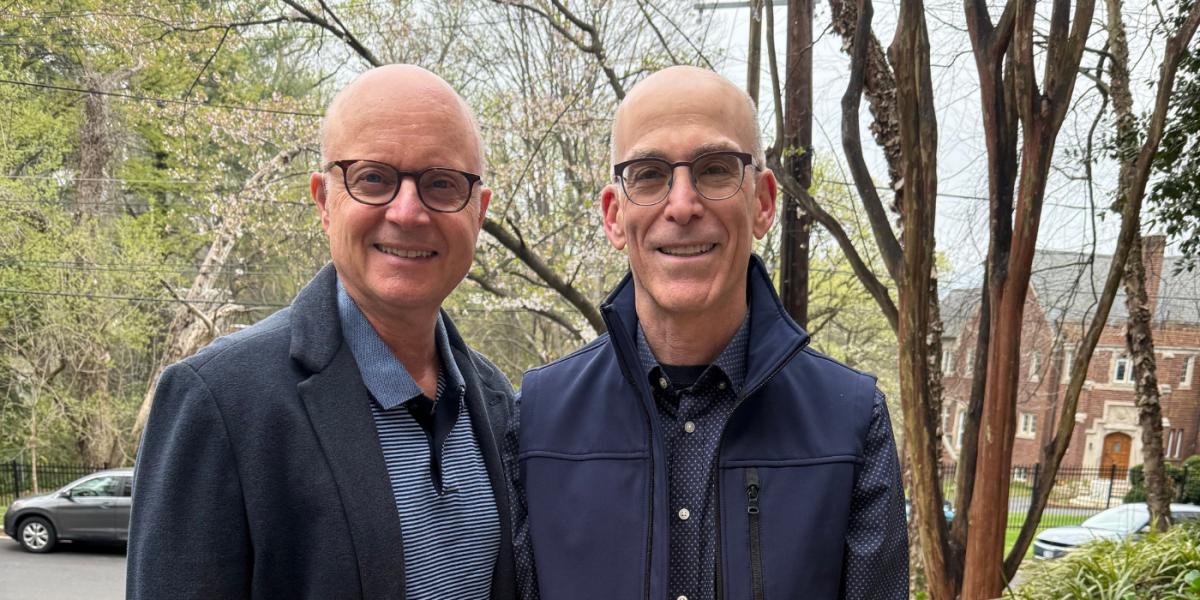SPH prof Bradley Boekeloo and his partner Stan Drake smile to the camera
