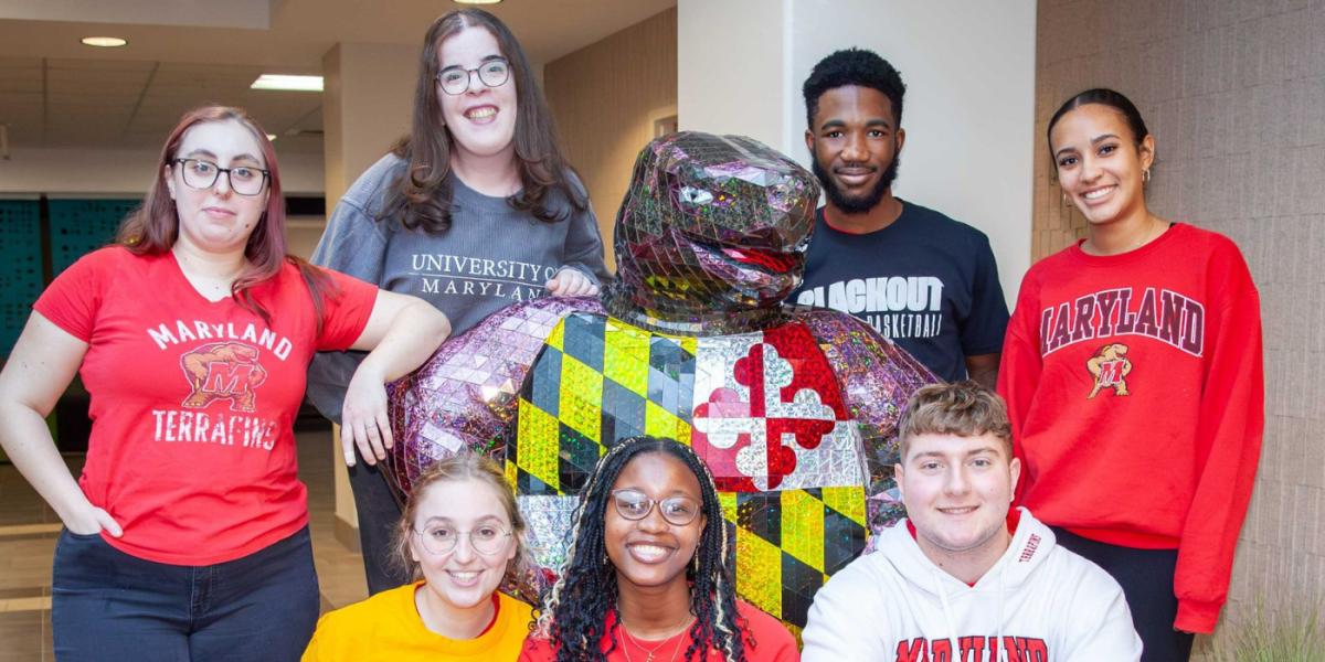 group of students posing with Testudo