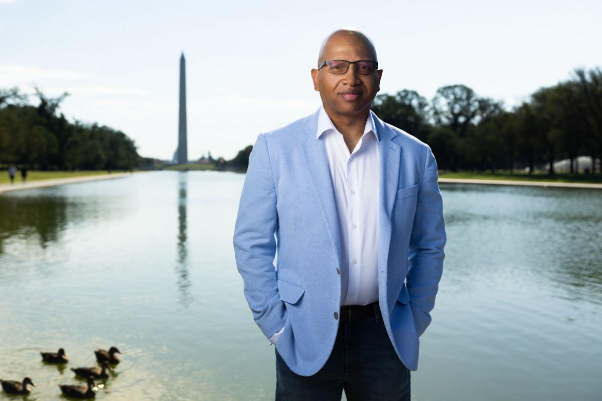 Image of Sacoby Wilson standing on National Mall in front of Washington Monument