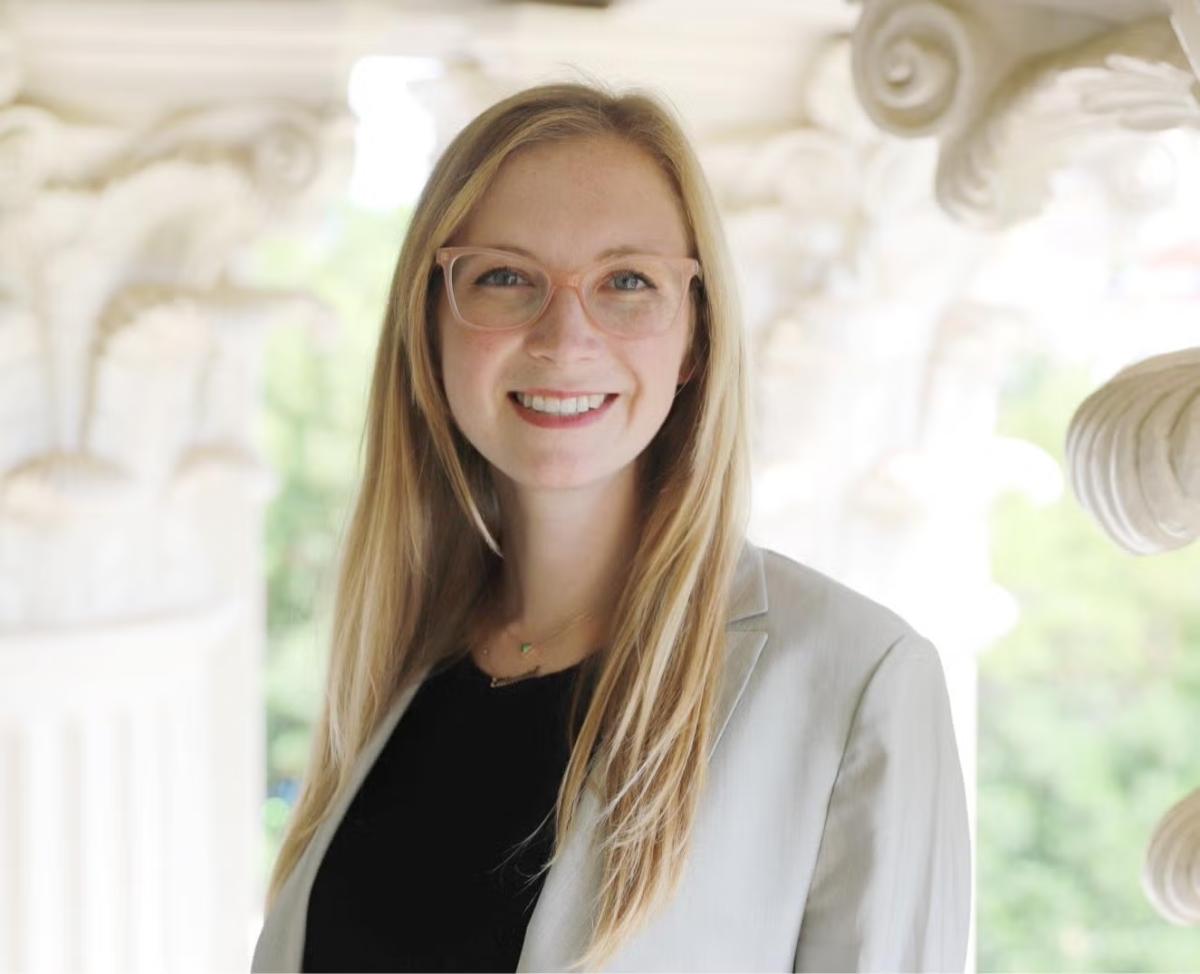 woman with long blonde hair in business attire