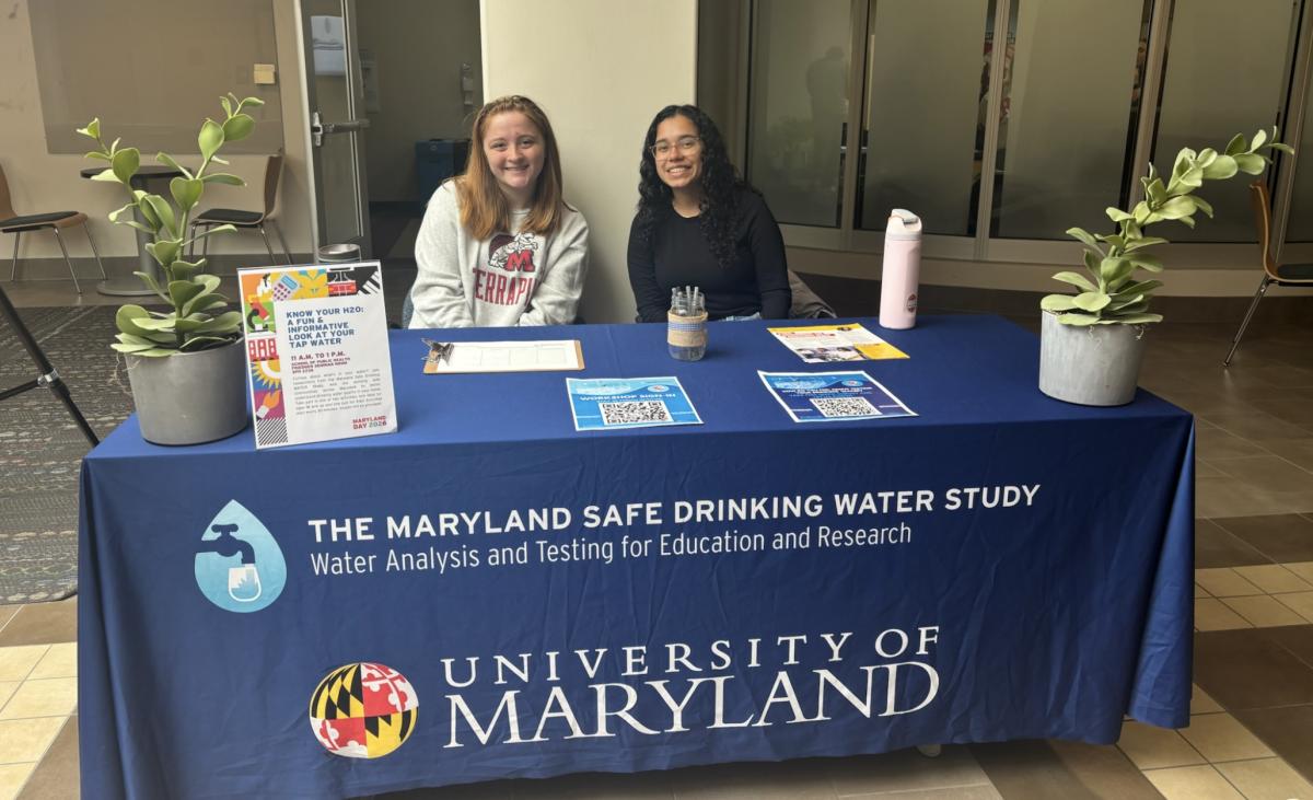 UMD students at a fair table