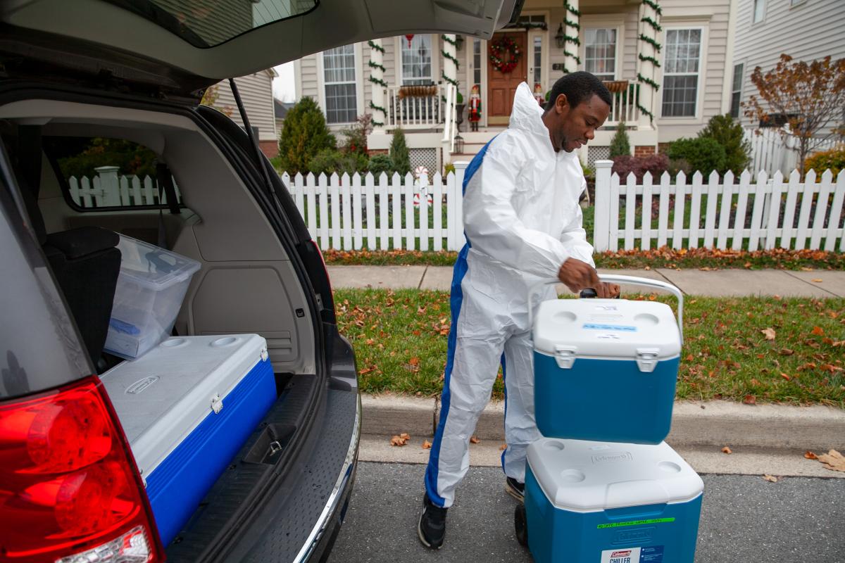 grad assistant takes out water testing gear from car
