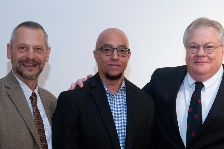 Boris Lushniak, Michael Brown and Brad Hatfield stand shoulder to shoulder smiling