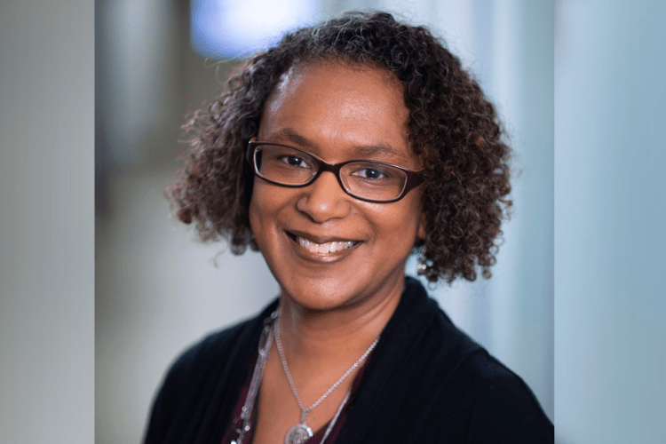 Professor Devon Payne-sturges, a black woman smiles at camera