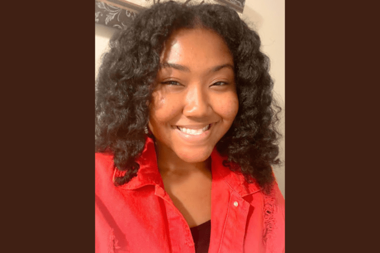 Black female student wearing a red shirt