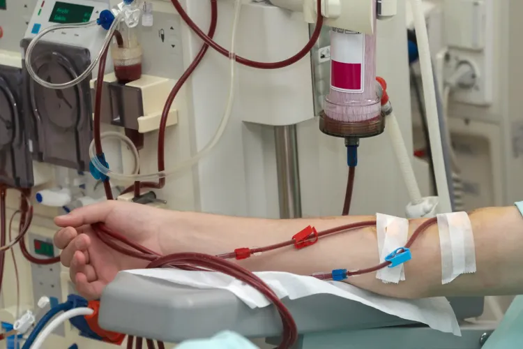 blood being drawn from arm into kidney testing machine