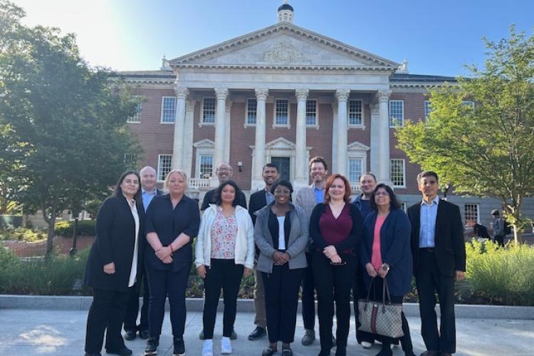 U21 group pose in front of Maryland building