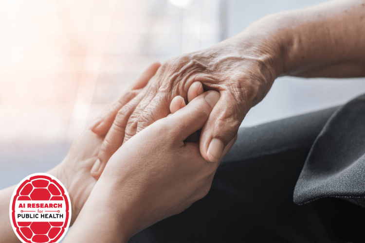 two youthful hands hold an older person's hand