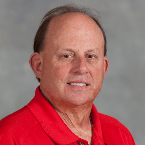 Male in red polo shirt with UMD Terp logo