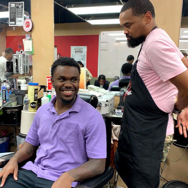 Summer Intern Students visit Black Barber shop as part of the Health Advocates In-Reach and Research (HAIR)