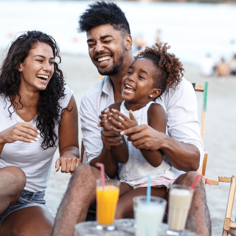 Family of three laughing